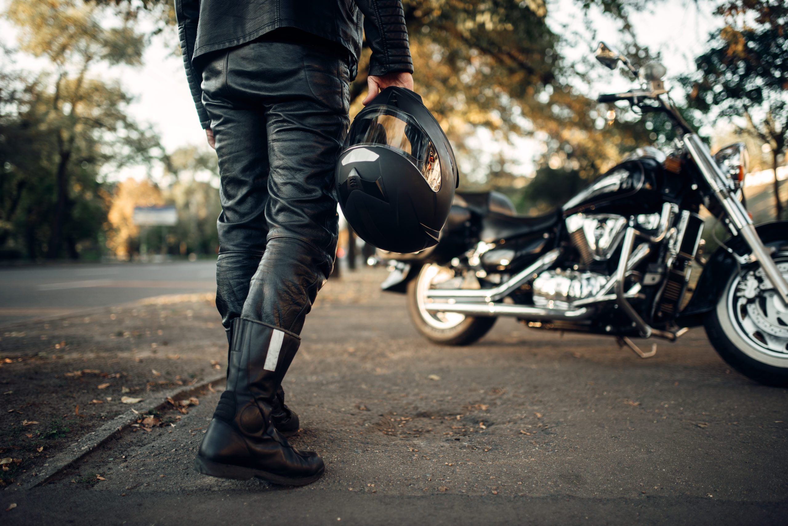 Person Holding Motorcycle Helmet